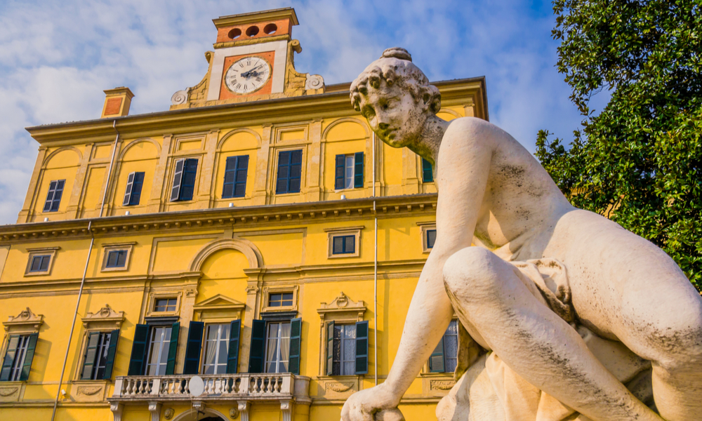 The Best things to do in Parma, Italy: Impressive view of Ducal garden's palace with close-up of marble statue, Parma, Italy