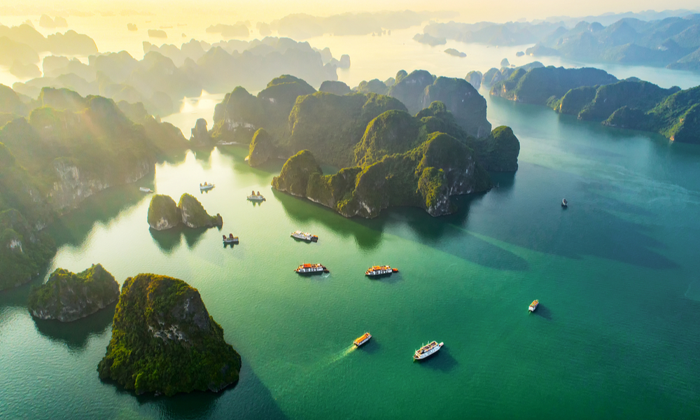 fun places to go visit in 2020:Aerial view floating fishing village and rock island, Halong Bay, Vietnam, Southeast Asia. 