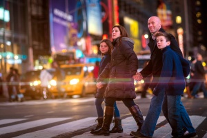 things to do in new york with kids: Family crossing Broadway in Times Square, New York City