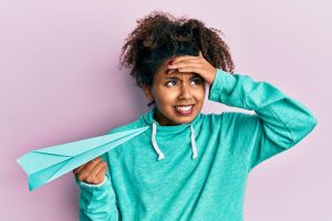 Woman frustrated by lack of airplane etiquette