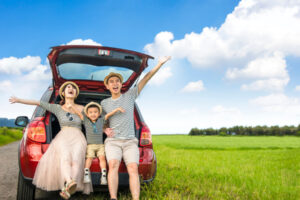 Family in the car on a spring road trip