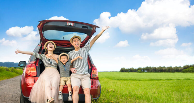 Family in the car on a spring road trip