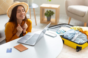 woman celebrating cheap flight day