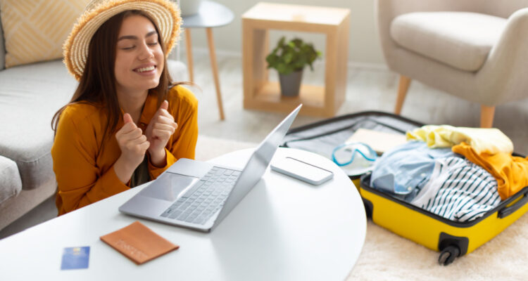 woman celebrating cheap flight day