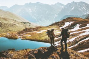 Couple exploring a mountain lake