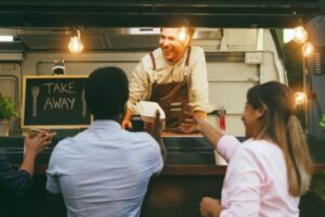 People eating at food truck