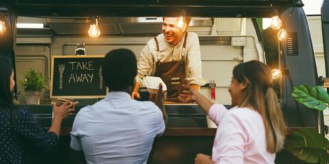 People eating at food truck