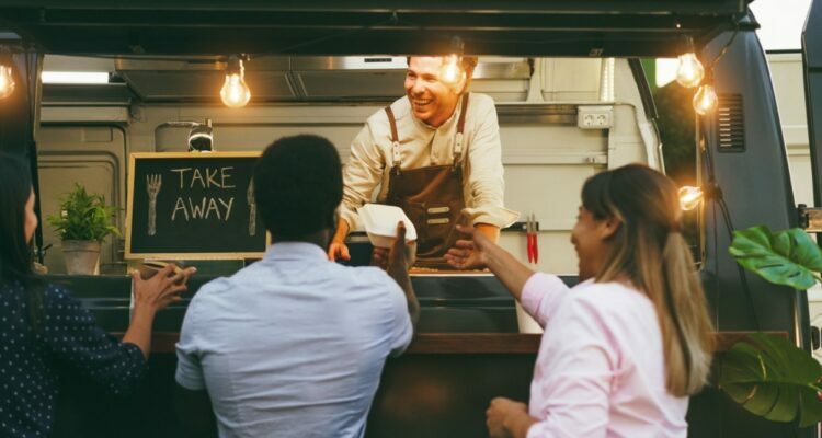 People eating at food truck