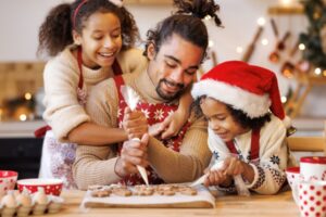 Family decorating gingerbread cookies