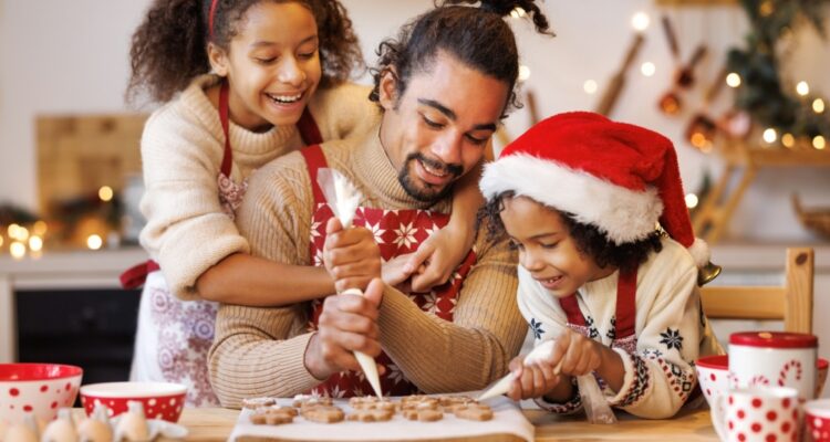 Family decorating gingerbread cookies