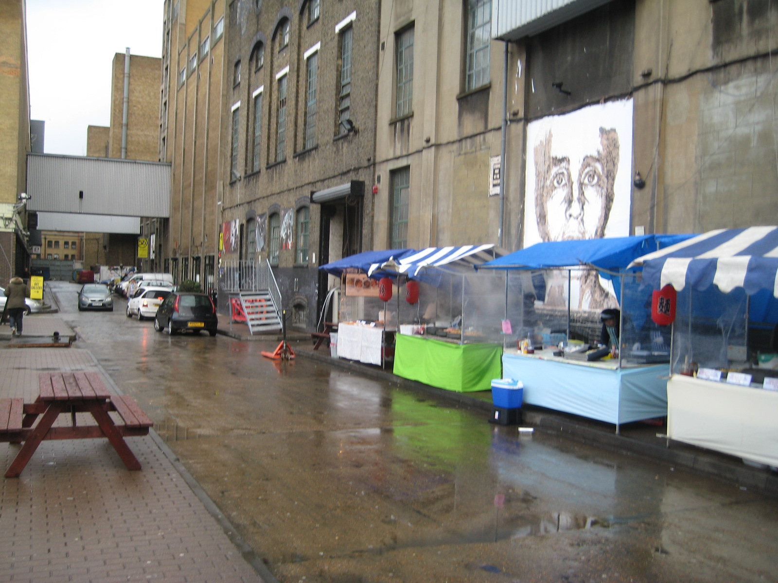 Side street filled with amazing smelling food carts