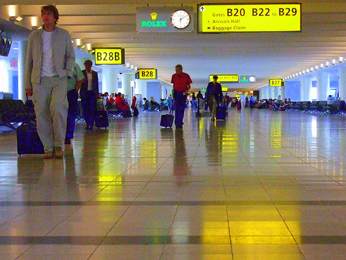 Passengers walking in John F. Kennedy International Airport terminal