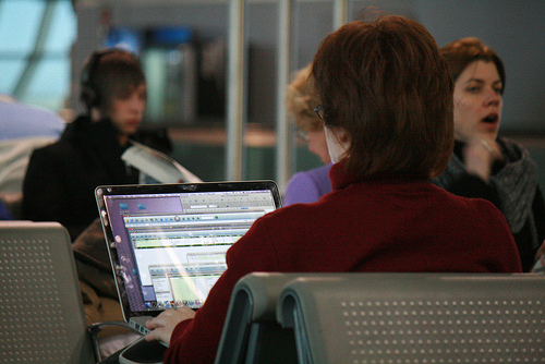 "Working while waiting for plane," CC Flickr photo credit: jepoirrier