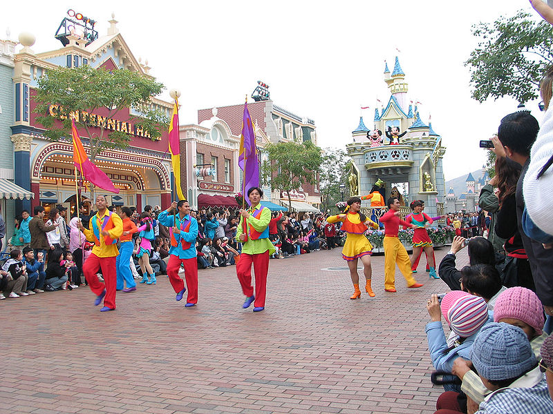 Spectators enjoy a parade in Disneyland Hong Kong (Image: 
Wikimedia)