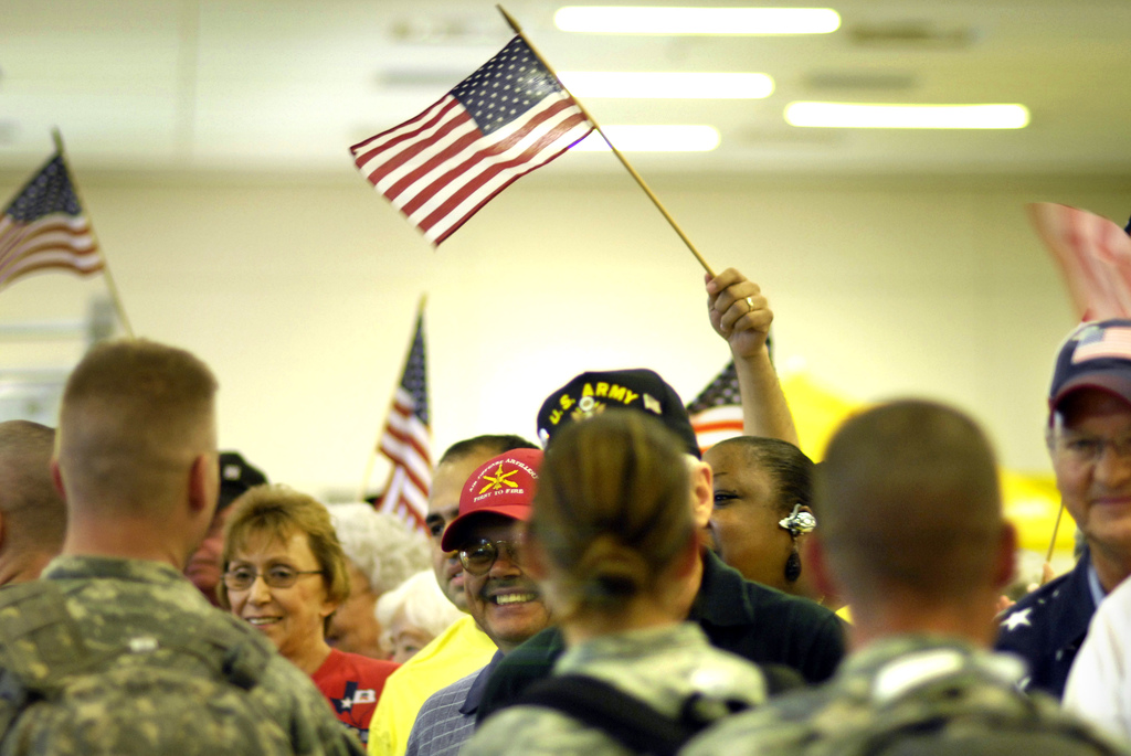 Returning troops are greeted by family and friends at Dallas Fort 
Worth International Airport (Image courtest of the U.S. Army)