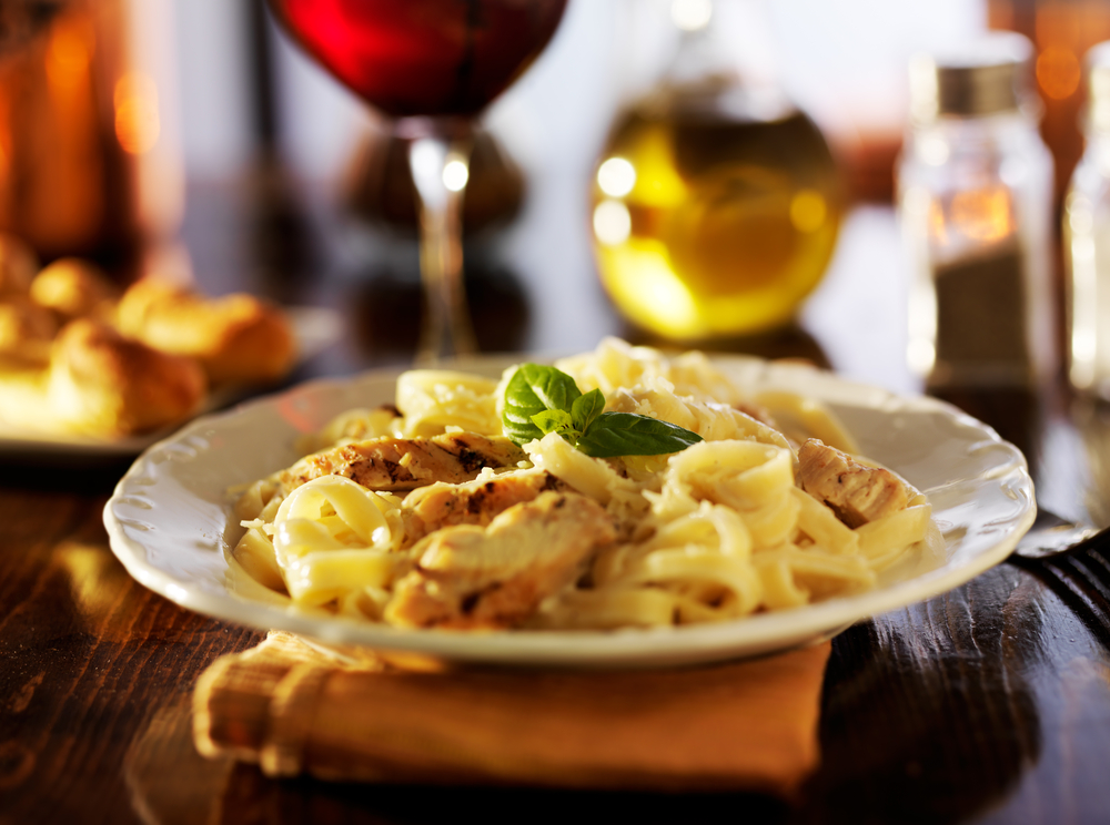 fettuccine alfredo with grilled chicken dinner at night