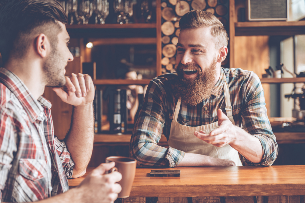 bartender and customer laughing