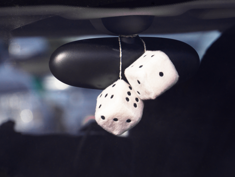 dice hanging from rear view mirror