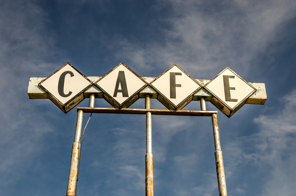 Large, generic sign for a cafe on Route 66.