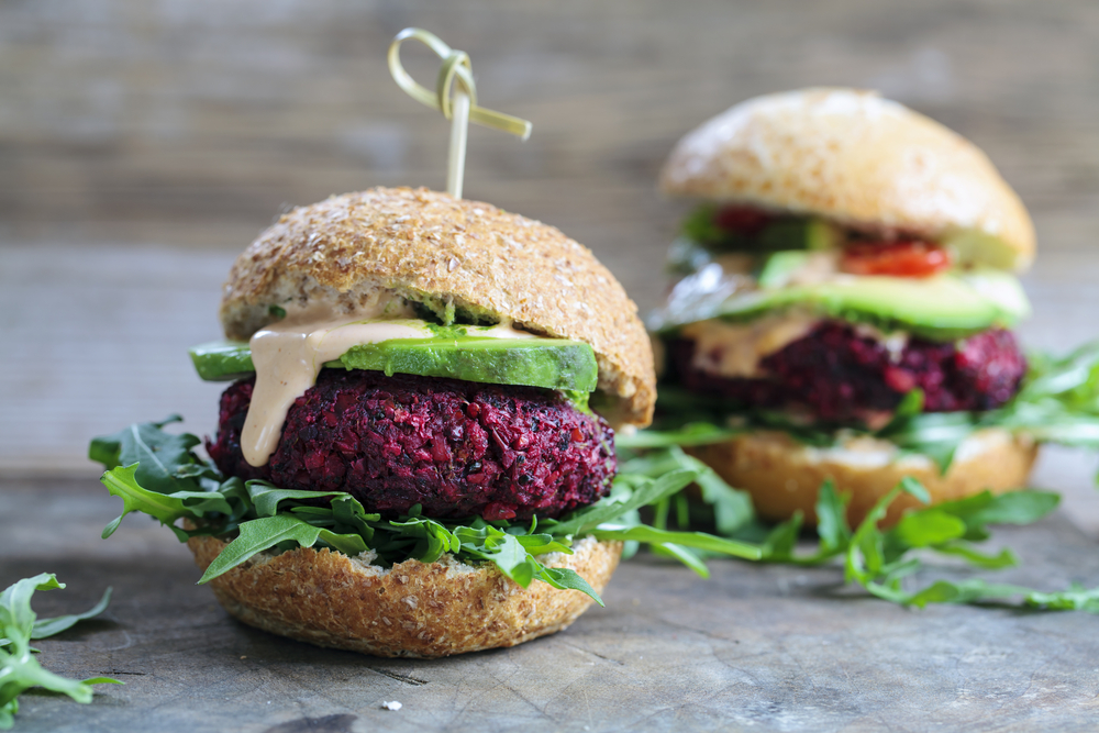 Vegetarian beetroot burgers with arugula and avocado