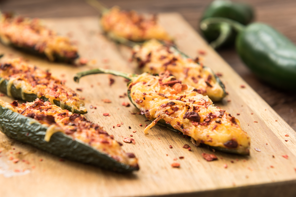 Homemade jalapeno baked with cheese, sauce and flakes of red pepper