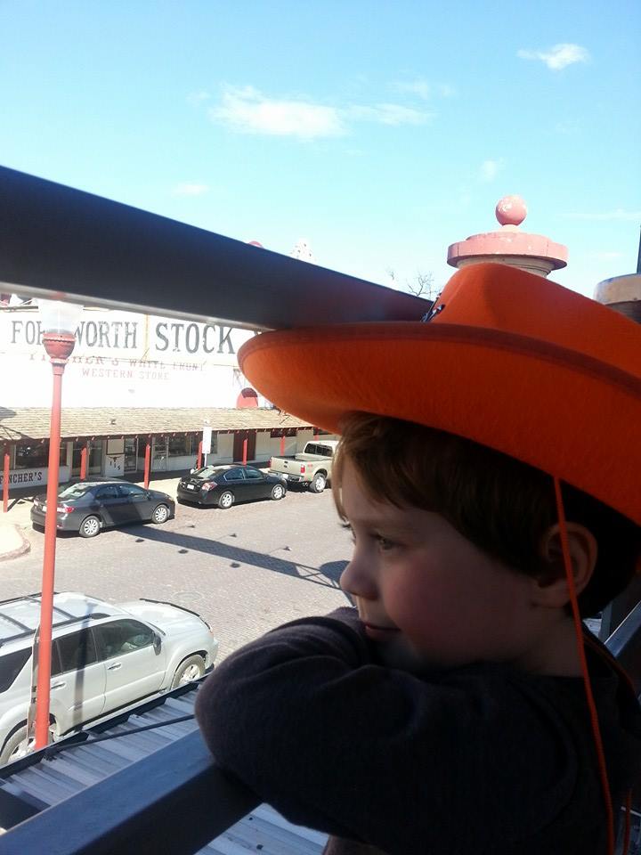 Liam waiting for the longhorns to march during the daily cattle drive at the Fort Worth Stockyards