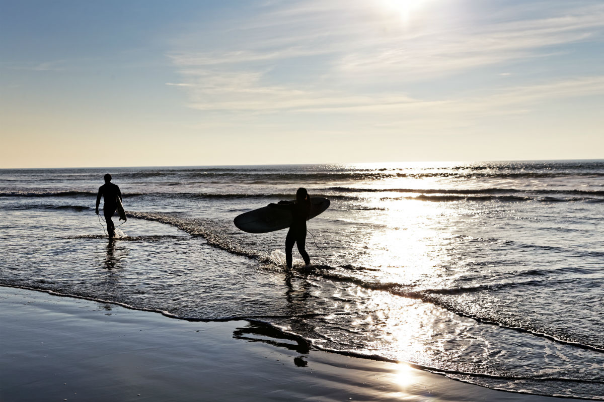 Surfers on beach