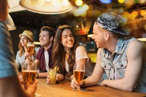 Young people having a drink at a table