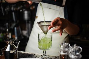 bartender pouring cocktail