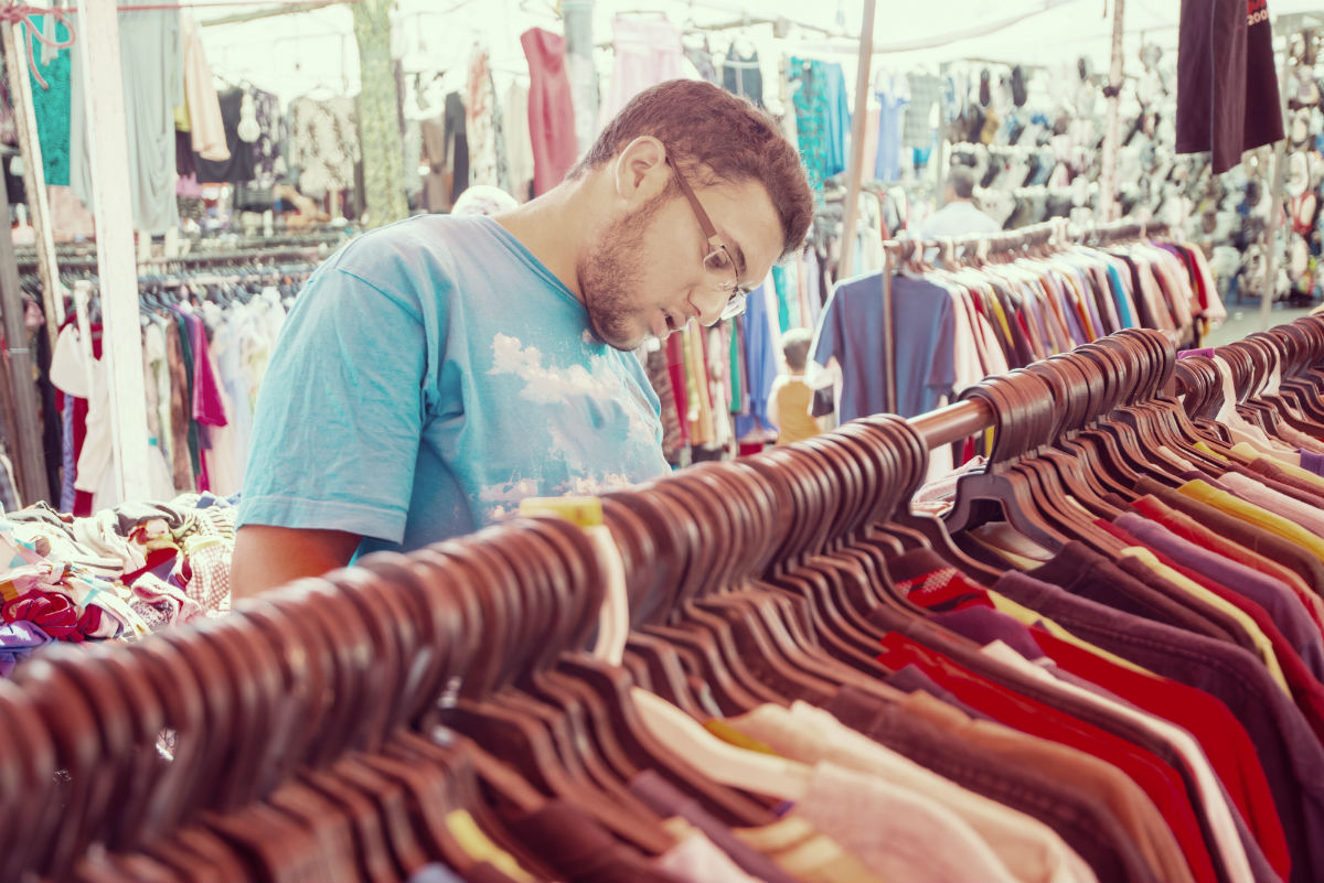 man shopping in thrift store