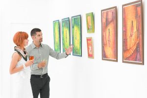 young couple checking out art in a gallery