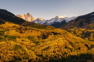 Fall foliage color and big mountain with snow on top. Capital Peak, Snowmass Wilderness, Colorado