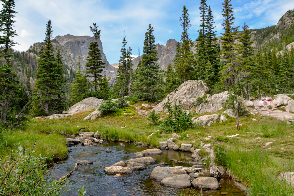 Tyndall creek crossing Emerald Lake trail with Hallett peak in the background Rocky Mountain National Park, Estes Park, Colorado, United States