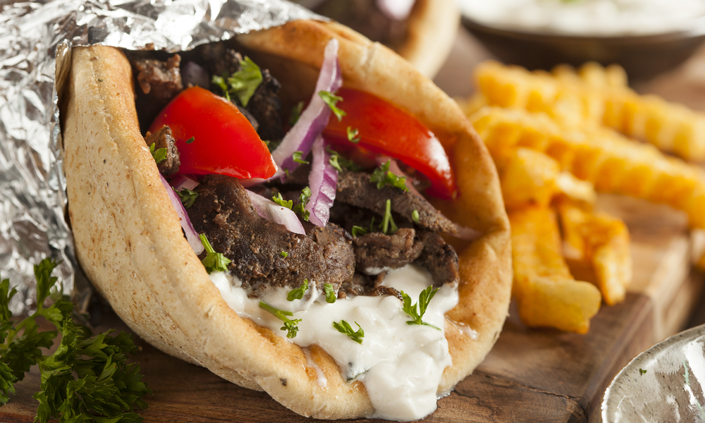 Homemade Meat Gyro with Tzatziki Sauce, tomatos and French Fries