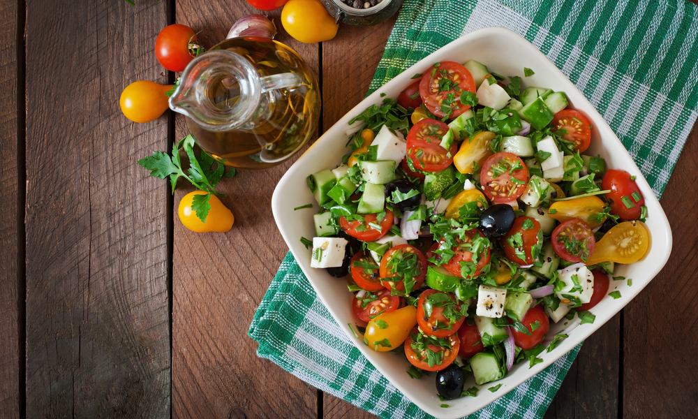 Greek salad with fresh vegetables, feta cheese and black olives