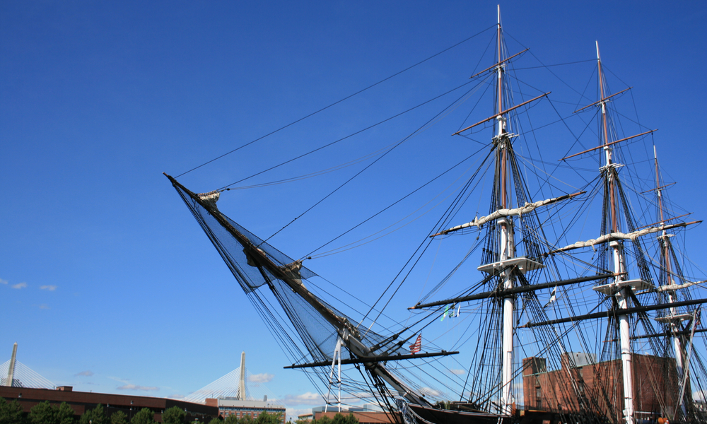 The USS Constitution in Boston, Massachusetts. Zakim Bunker Hill Bridge in the background.