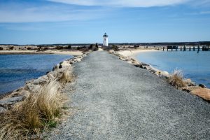 Paved jetty walkway to the Edgartown Lighthouse on Martha's Vineyard Massachusetts