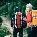 Man and woman hikers trekking in mountains